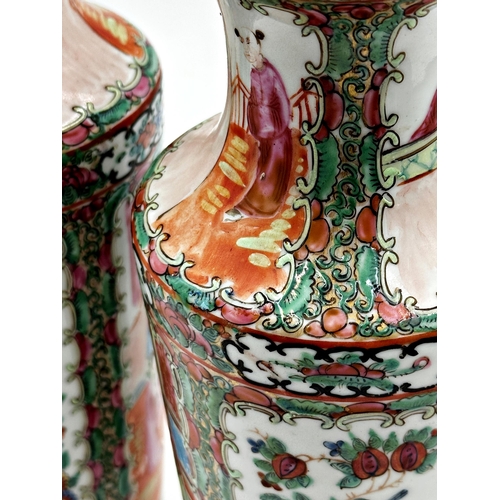 451 - A pair of late 19th century Canton Famille Rose vases, 31cm high, together with three further Famill... 