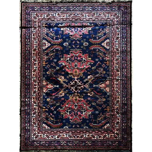 1597 - Good Turkish country house carpet, three red medallions on a blue ground,  L375 x  W255cm