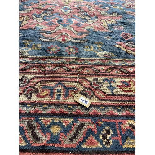 1597 - Good Turkish country house carpet, three red medallions on a blue ground,  L375 x  W255cm