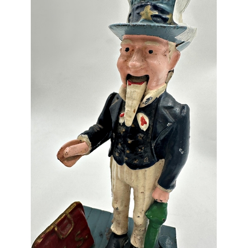 618 - Vintage cast iron Uncle Sam money box, 29cm high