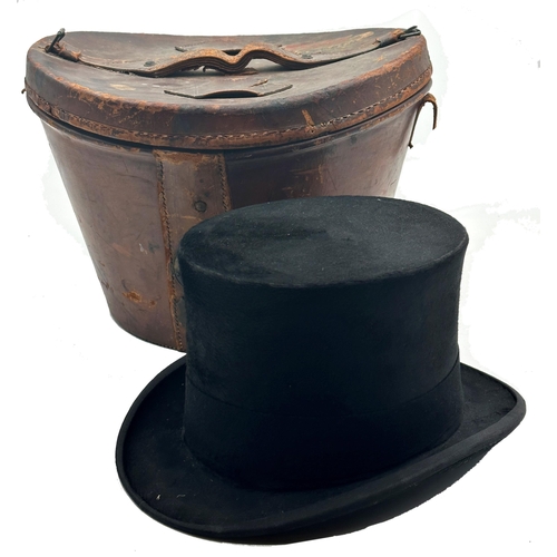 1584 - Two good quality silk top hats by Locke & Co Hatters of St James, London, with their original leathe... 