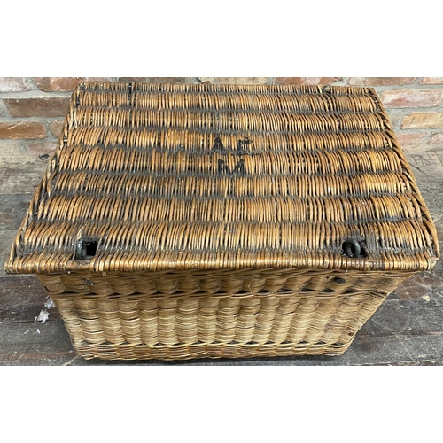 1328 - Early 20th century large wicker hamper, hinged lid enclosing a linen lined interior upon castors, 51... 