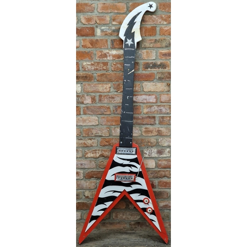 1292 - Novelty oversized wooden flying V electric guitar, with zebra print and glitter and gem decoration, ... 