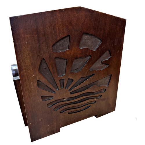 724 - Good novelty Art Deco mahogany radio, the front panel speaker pierced with a sunburst landscape, upo... 