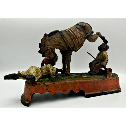 667 - Late 19th century 'always did spise a mule bank' cast iron mechanical money box, 26cm long (af)