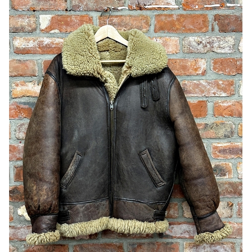 1565 - Aviator brown leather flight jacket lined in sheepskin. With collar and cuffs, adjustable belted str... 