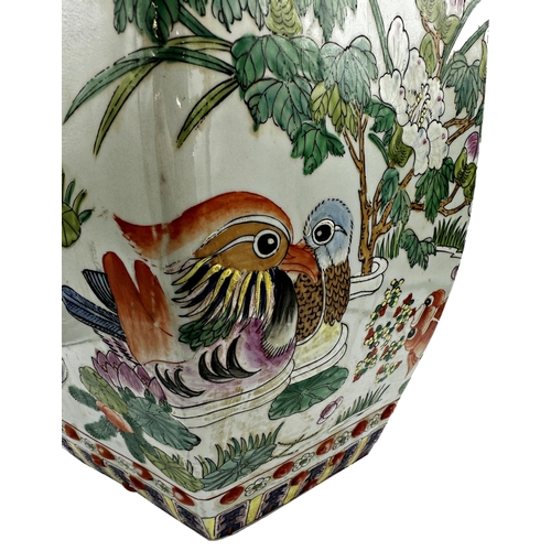 535 - Chinese porcelain hexagonal garden seat, enamelled with fish, ducks and lotus flowers, 46cm high x 3... 