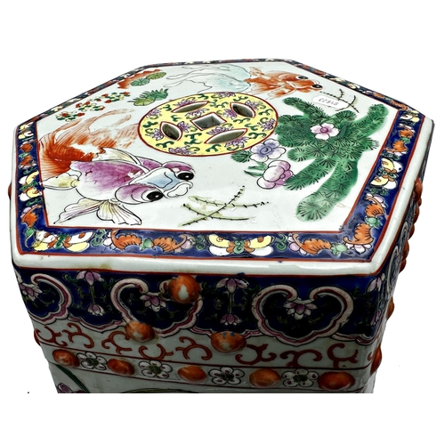 535 - Chinese porcelain hexagonal garden seat, enamelled with fish, ducks and lotus flowers, 46cm high x 3... 