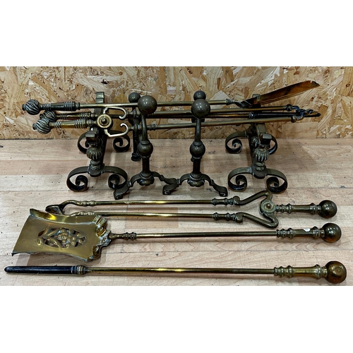 658 - Two sets of three brass fire irons together with two pairs of fire dogs (10)