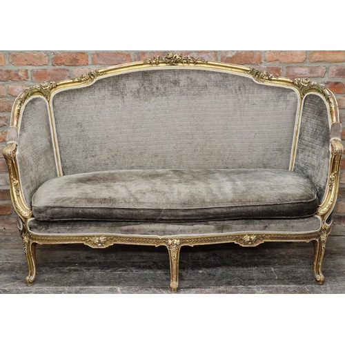 1323 - 19th century French giltwood and gesso salon couch, the open frame work carved with flowers with a g... 