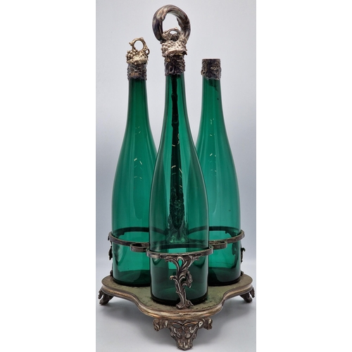 348 - Late 19th century silver plated three bottle cruet with carry handle, fitted with three glass bottle... 