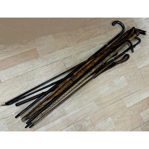 747 - Collection of ten various walking sticks/canes to include a silver topped crooked bamboo shafted exa... 