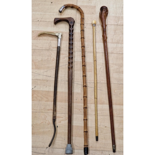 748 - Collection of good antique walking sticks comprising a bamboo crook handled stick with silver knop, ... 