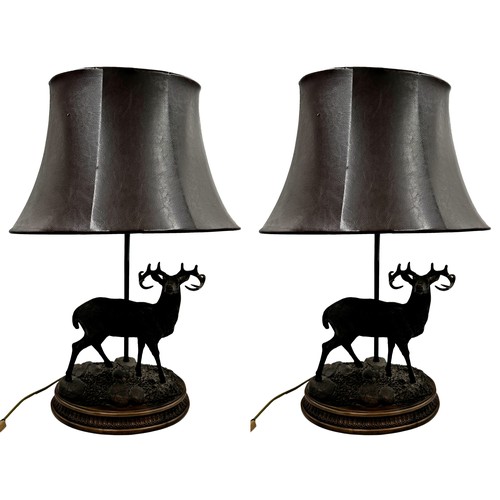 1185 - A pair of good quality novelty table lamps in the form of standing resin stags, with leather type ta... 