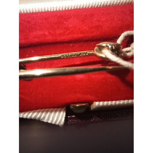 175 - 9ct fox head tie pin, ruby set eyes, 6.8cm long, 6.8g, in associated Asprey box