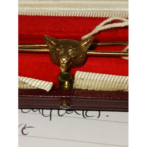 175 - 9ct fox head tie pin, ruby set eyes, 6.8cm long, 6.8g, in associated Asprey box