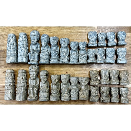 523 - Interesting tribal carved plaster chess set (complete), kept with three turned hardwood boxes