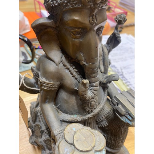 511 - Eastern bronze study of Ganesh seated on a lotus flower, 22cm high