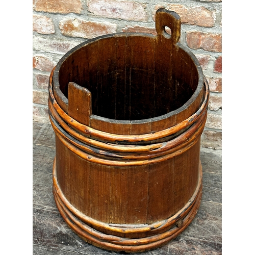 2323 - Primitive coopered grain barrel with bamboo strapwork, 60cm high x 58cm diameter