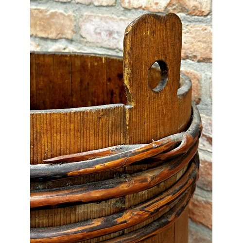 2323 - Primitive coopered grain barrel with bamboo strapwork, 60cm high x 58cm diameter