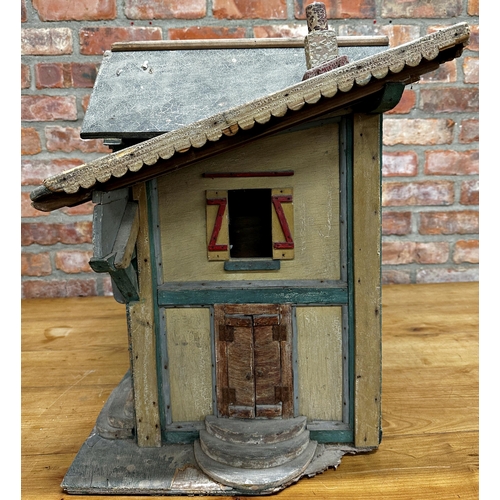 252 - Good large Folk Art dolls house of a stable building, with original paint and shutter doors and wind... 