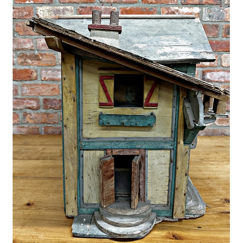 252 - Good large Folk Art dolls house of a stable building, with original paint and shutter doors and wind... 