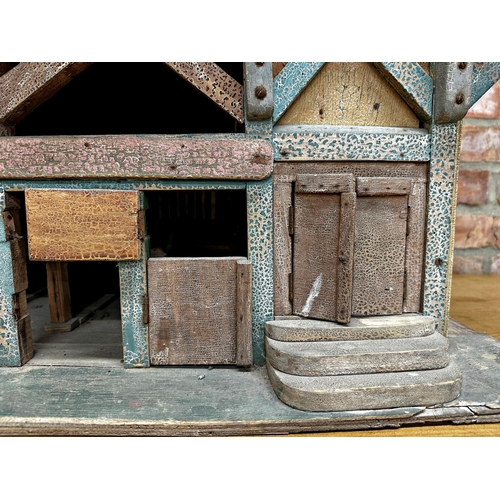 252 - Good large Folk Art dolls house of a stable building, with original paint and shutter doors and wind... 