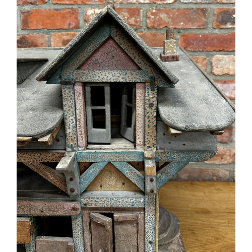 252 - Good large Folk Art dolls house of a stable building, with original paint and shutter doors and wind... 