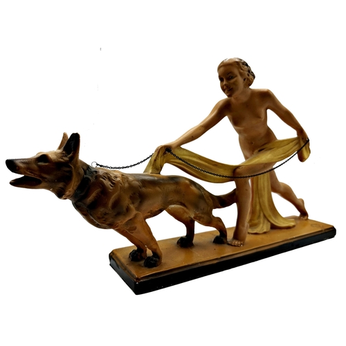 164 - Classic 1930s plaster figure of a nude female being pulled by an Alsatian dog on a lead, L 59cm