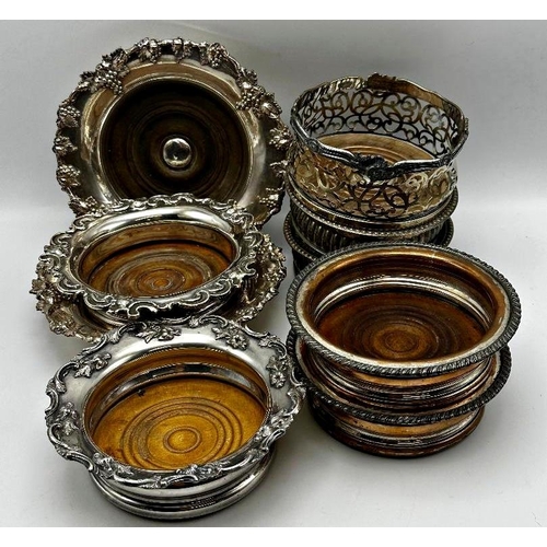 1242 - Three pairs of antique silver plated wine coasters together with a further four examples with turned... 