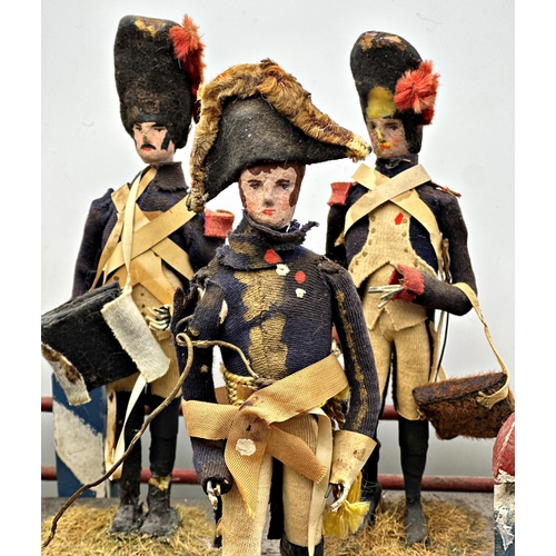 253 - Good late 19th century Folk Art diorama of hand crafted Napoleonic figures on a painted two tier sta... 