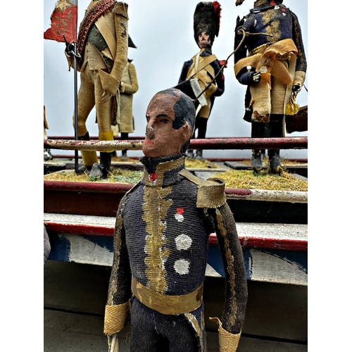 253 - Good late 19th century Folk Art diorama of hand crafted Napoleonic figures on a painted two tier sta... 