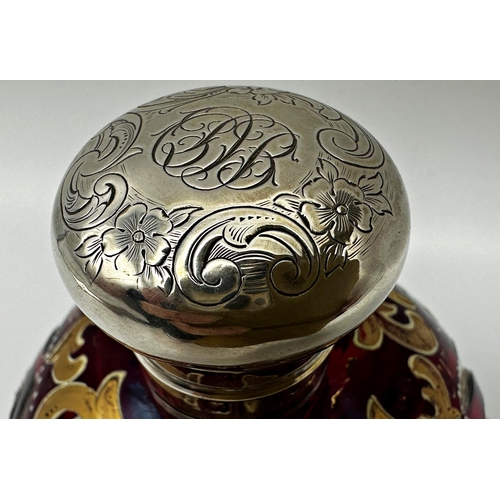 166 - Antique continental bohemian cranberry glass scent bottle with silver lid and gilt and enamel overla... 