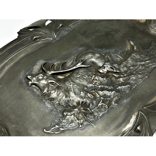 311 - WMF pewter tray embossed with a stag hunting scene, 25 x 59cm