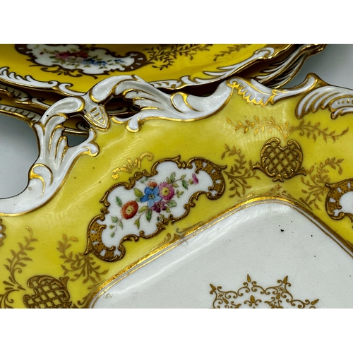 169 - Coalport hand painted porcelain desert service with floral sprays and gilt overlay on a yellow groun... 