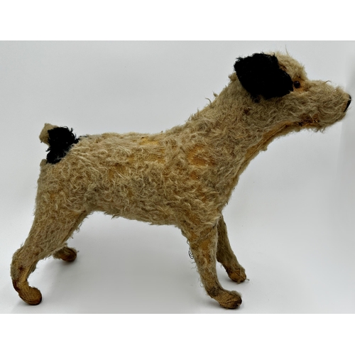 443 - Early straw stuffed standing dog, 33cm high x 42cm long with a further vintage teddy (2)