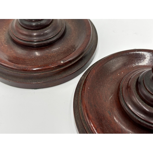 268 - Pair of 19th century turned mahogany candlesticks, 30cm high