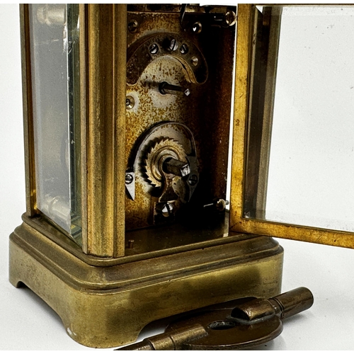 1055 - Miniature brass cased carriage clock, 7.25cm high