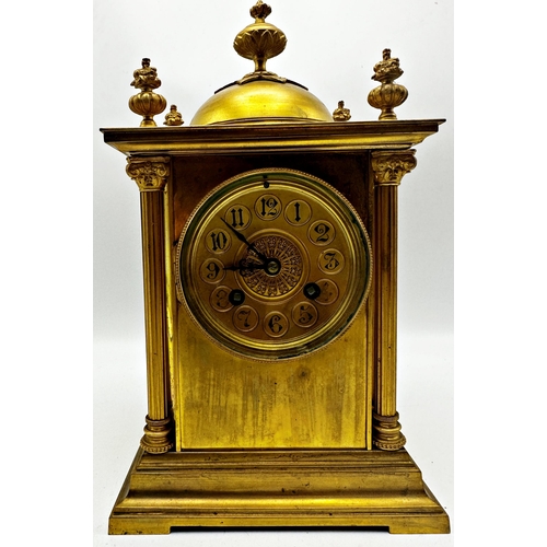 1051 - French gilt metal mantel clock with Corinthian column pillared case mounted by an Islamic finial, tw... 