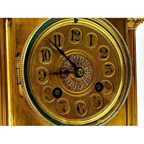 1051 - French gilt metal mantel clock with Corinthian column pillared case mounted by an Islamic finial, tw... 