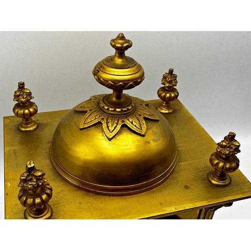 1051 - French gilt metal mantel clock with Corinthian column pillared case mounted by an Islamic finial, tw... 