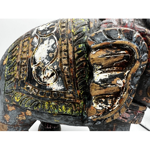 213 - Indian carved wooden painted elephant, 30cm high x 33cm long