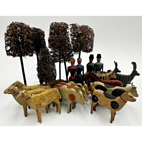 267 - Folk Art carved and painted wooden farmyard animals with farmer and wife characters and trees