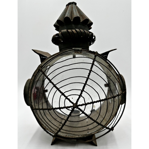 2192 - 19th century circular sheet metal storm lantern, twin glass panels flanked with smaller side panels,... 