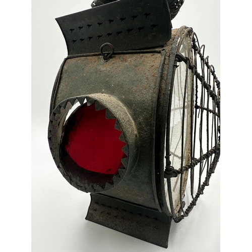 2192 - 19th century circular sheet metal storm lantern, twin glass panels flanked with smaller side panels,... 