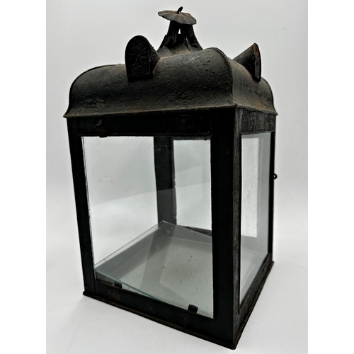 2193 - 19th century pagoda shaped japanned tin hall lantern, with glass base, 38cm high