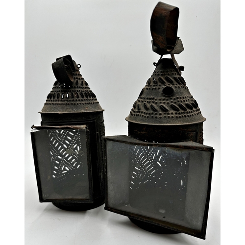 2194 - Matched pair of 19th century pierced sheet metal storm lanterns, conical form, 28cm high approx