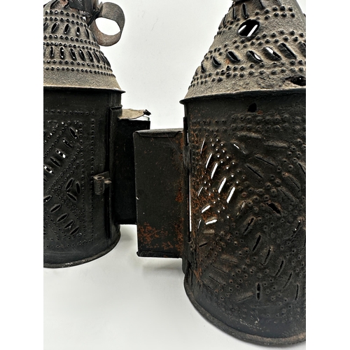 2194 - Matched pair of 19th century pierced sheet metal storm lanterns, conical form, 28cm high approx