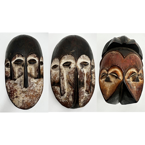 216 - Tribal interest - three Nigerian 'Joroba' carved twin faced masks, the largest 36 x 20cm