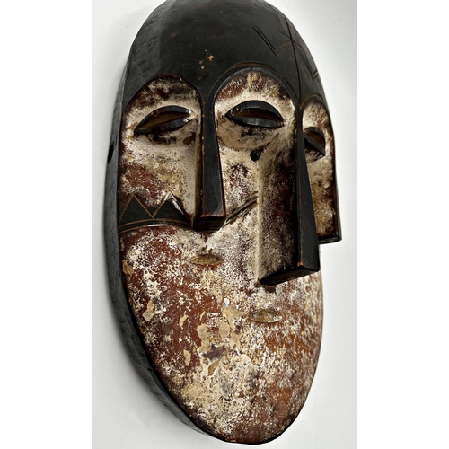 216 - Tribal interest - three Nigerian 'Joroba' carved twin faced masks, the largest 36 x 20cm